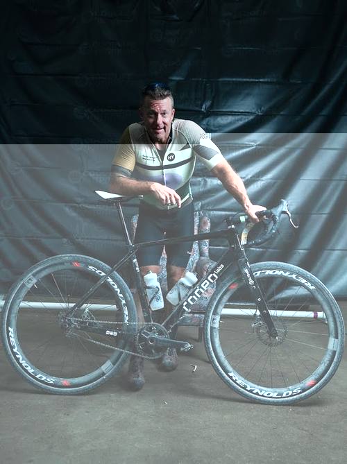 Jason Kayzar posing with his gravel bike before Gravel Worlds 2025